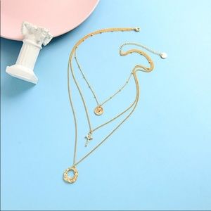 Gold colored cross necklace